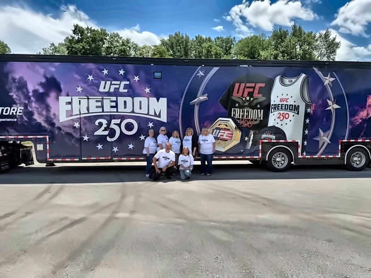 CW crew lined up in front of a UFC trailer